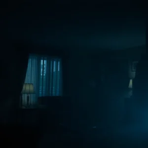 Dimly lit living room depicting the aftermath of an incident.