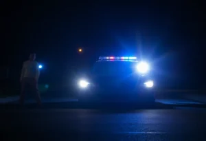 Police lights illuminating a dark street scene in Memphis