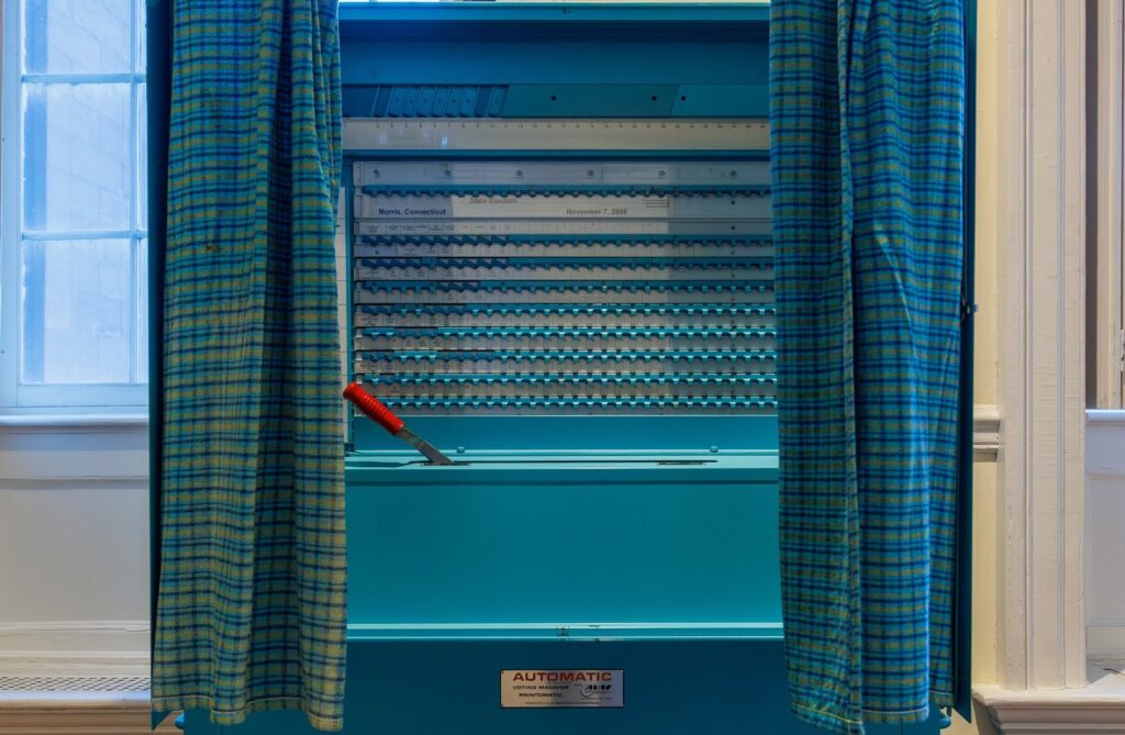 Voting booth with curtains open