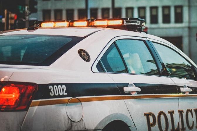 Police car parked along a city street
